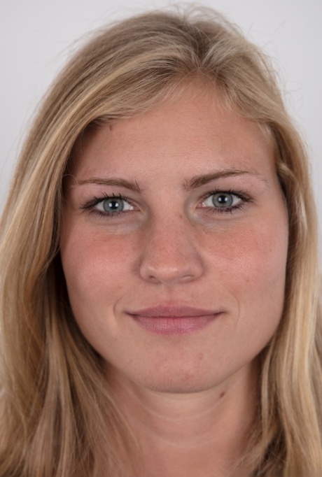 Pretty blonde Adriana strips off her jeans to show her big saggy breasts