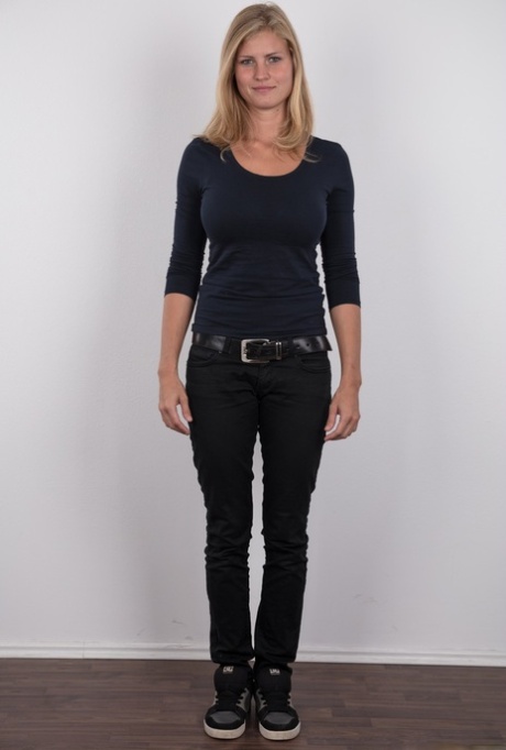 Pretty blonde Adriana strips off her jeans to show her big saggy breasts