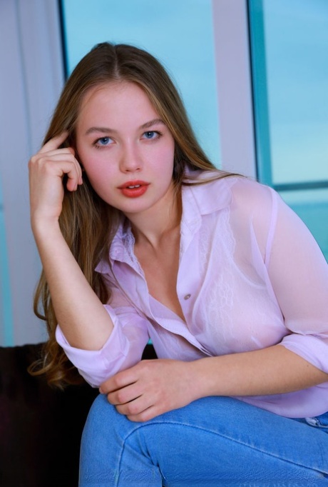 Perfect young adult model Camilla Stan doffs blue jeans to show her natural beauty