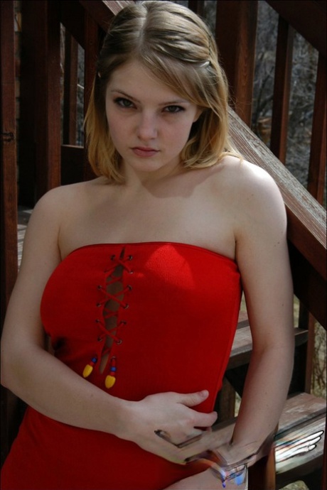 Young white girl Danielle reveals black upskirt panties outdoors