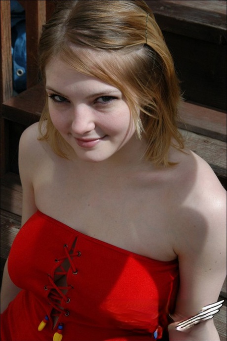 Young white girl Danielle reveals black upskirt panties outdoors