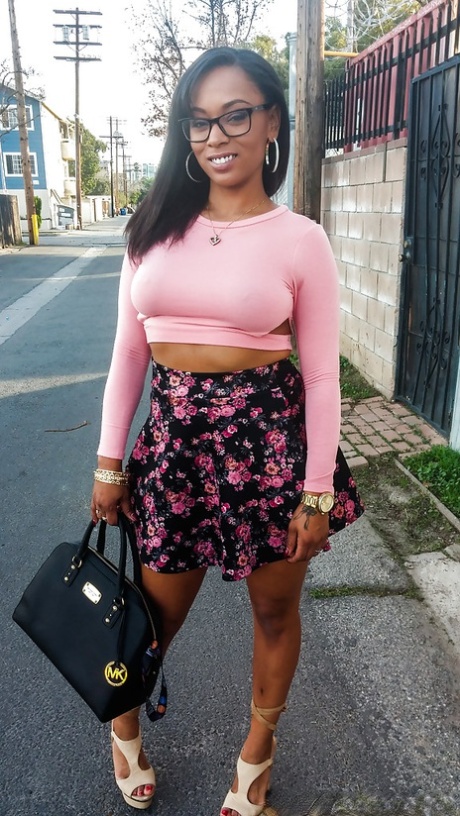 Busty ebony chick Porsha Carrera showing off her thong panties and phat curves