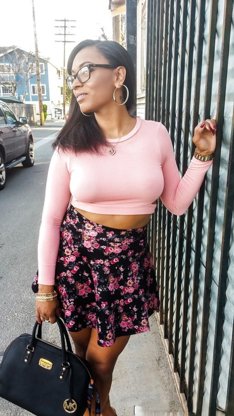 Busty ebony chick Porsha Carrera showing off her thong panties and phat curves