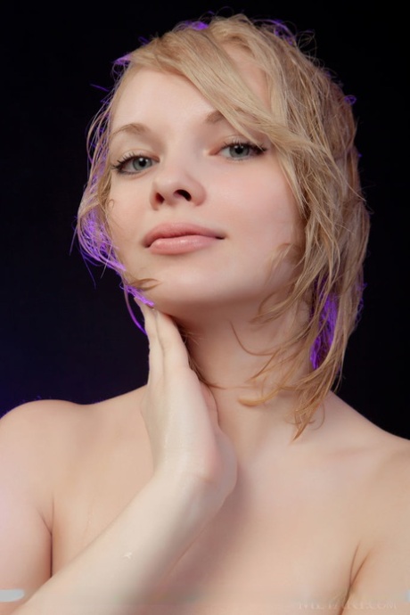 Smiley faced young adult Feeona A revealing toned body parts in the artistic