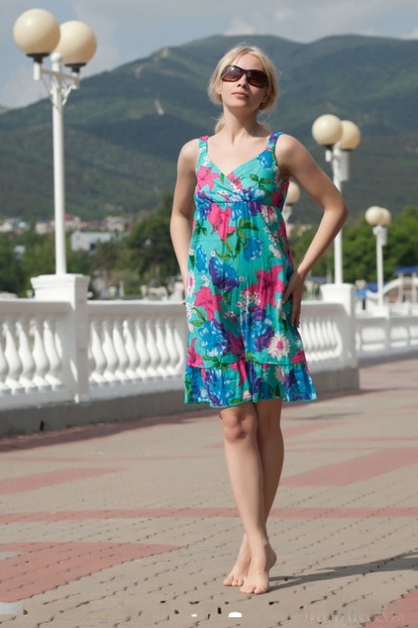 Smiley faced young adult Feeona A revealing toned body parts in the artistic