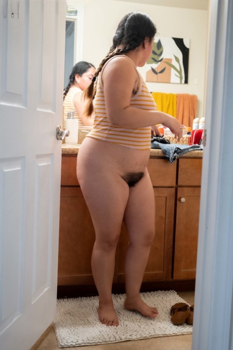 Chubby authentic Lola L shows her hairy femininity & her big curves while dressing
