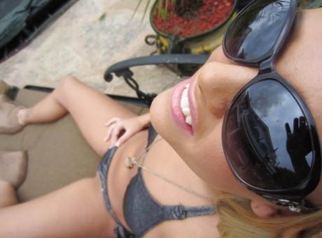 Curvy young adult blonde with big jugs Alexis Monroe slipping off her bikini