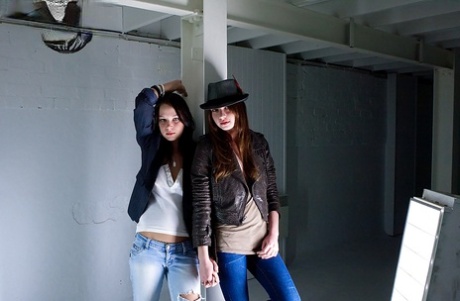 Young adult girls Carly T and Rebekah strip off ripped denim jeans to model artistic