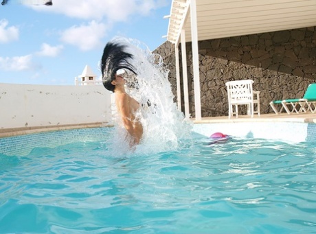 Amazingly alluring brunette authentic with long legs have some artistic pool fun