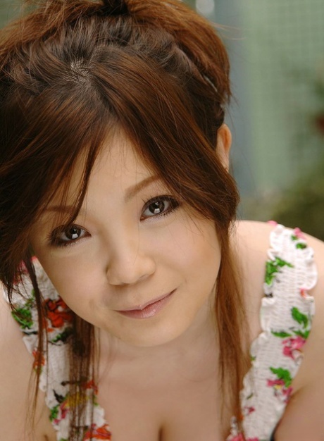 Pale Japanese girl Nami Ogawa frees her big naturals before changing undies