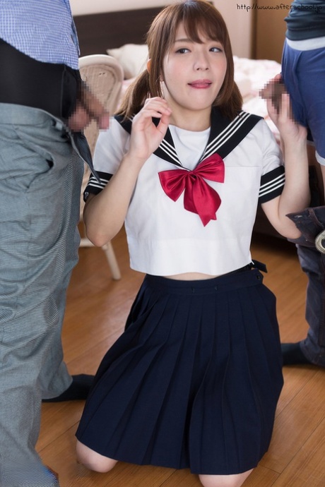 Japanese schoolgirl spits out climax after sucking off two cocks