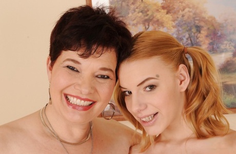 Fuckable granny and her graceful young adult girlfriend posing natural together