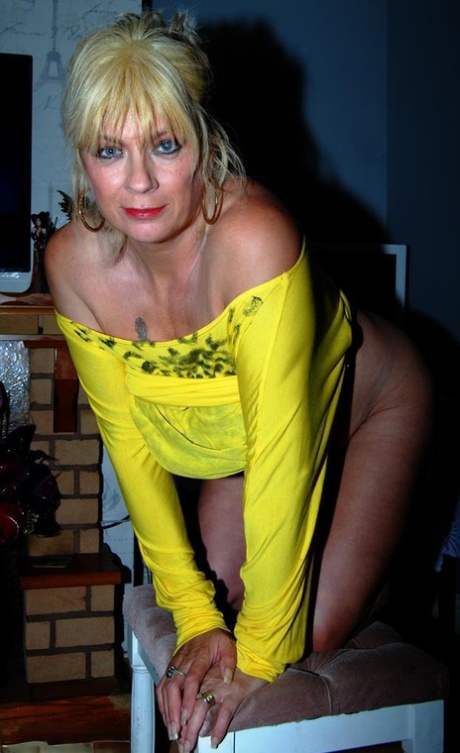 Attractive mature Dimonty hikes short dress for artistic upskirt & reveals her big breasts