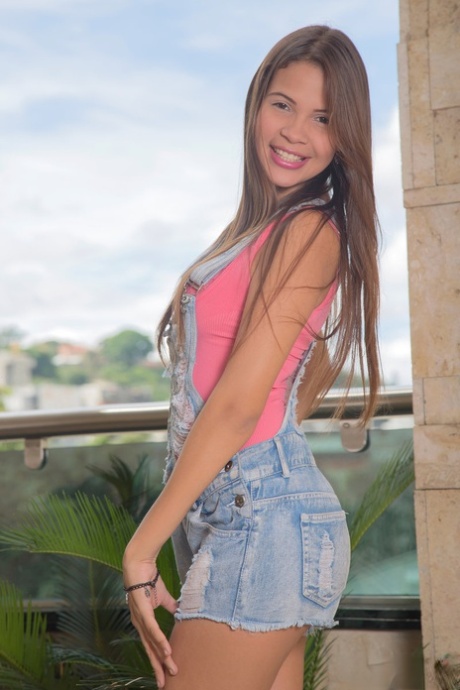 Cutie Kiara Lorens sheds shorts to show small young adult breasts & toy on the balcony