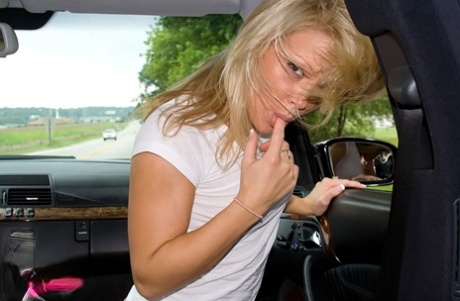 Bleach blonde amatuer Madden flips the bird while teasing in thong in her car