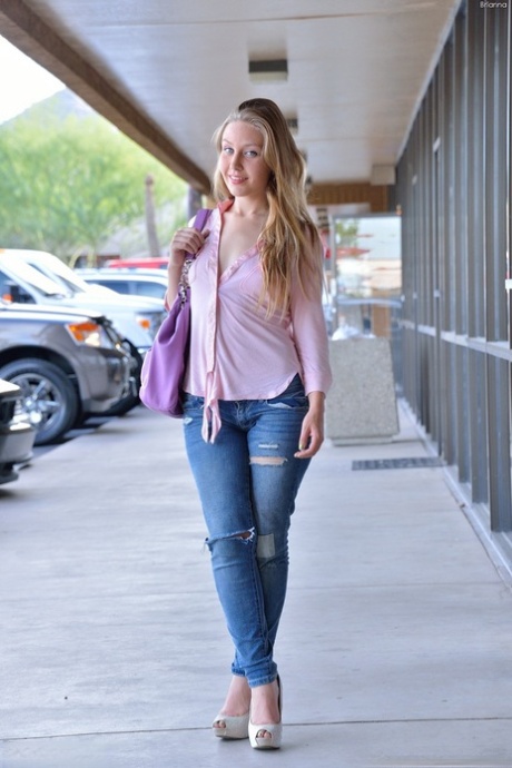 Gorgeous blonde filly with blue eyes enjoys stretching her tight cunt