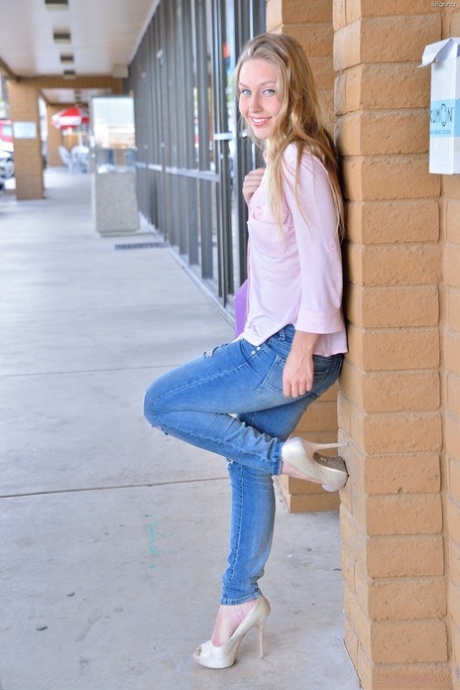 Gorgeous blonde filly with blue eyes enjoys stretching her tight cunt