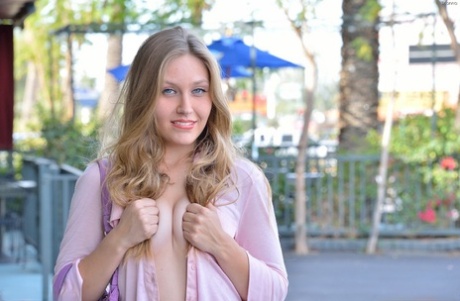 Gorgeous blonde filly with blue eyes enjoys stretching her tight cunt