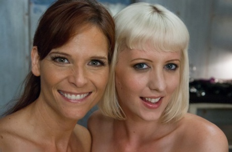 Attractive MILFs Syren de Mer and Krissy Lynn flaunt their huge breasts in BDSM action