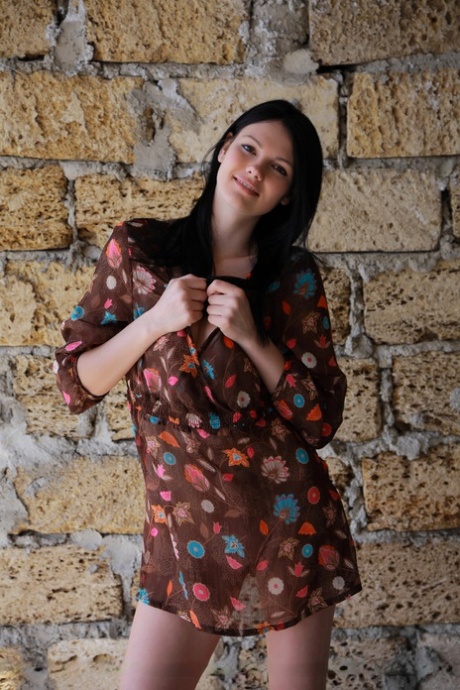 Alluring brunette Nichole A spreads legs for attractive natural upskirt outdoors