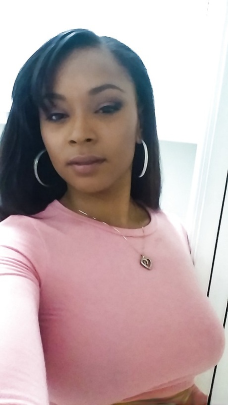 Curvy black chick Porsha Carrera taking selfies of her big black breasts