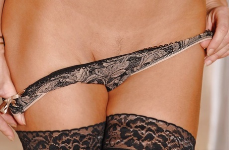 Beautiful French girl Mari striking alluring solo poses in stockings