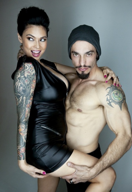 Tattooed alluring pornstar Asian showing big breasts in sheer lingerie