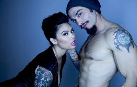 Tattooed alluring pornstar Asian showing big breasts in sheer lingerie