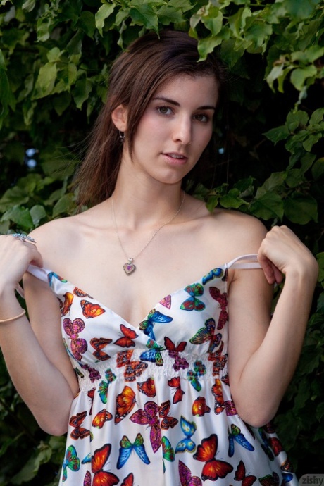 Adorable authentic young adult Melissa Johnston removes her dress and poses in undies