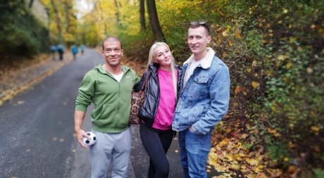 Blonde young adult Lovita Fate participates in MMF intimacy with older guys