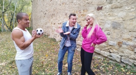 Blonde young adult Lovita Fate participates in MMF intimacy with older guys