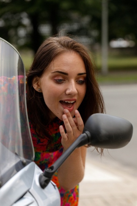 Pretty babe Oxana Chic flaunts her attractive legs while teasing in a alluring dress