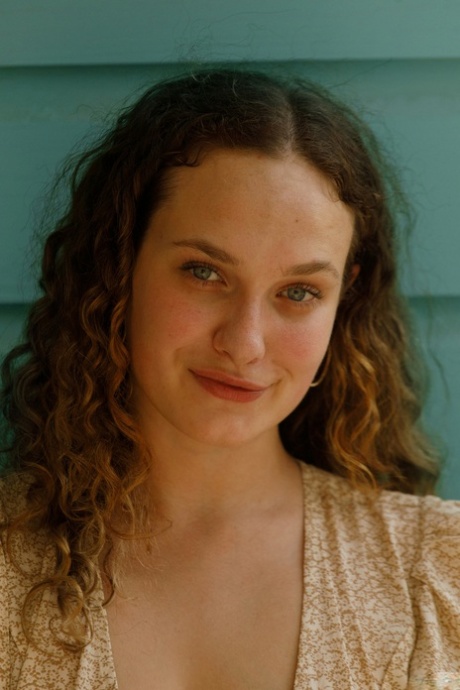 Beautiful curly haired authentic Carrie Barber shows her big curves in panties