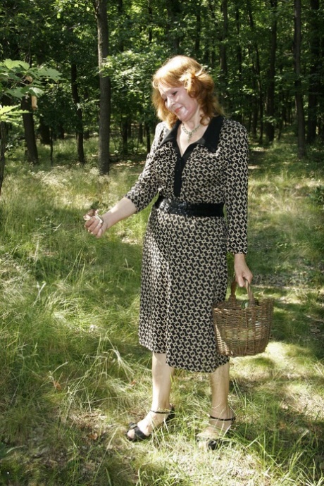 Wild granny Majesta gives oral pleasure to a young adult boy in nature & has intimacy