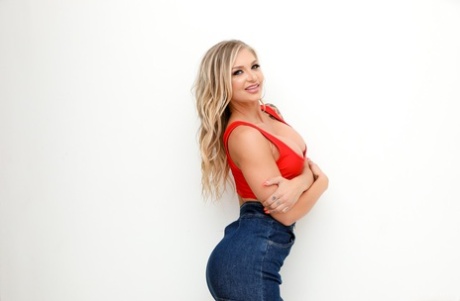 Attractive blonde Alison Avery strikes great SFW poses in a denim miniskirt