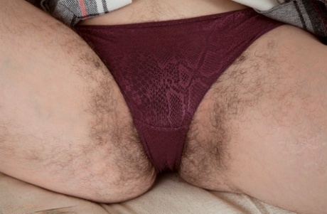 Authentic model hikes her skirt to show pubic hairs escaping from her underwear