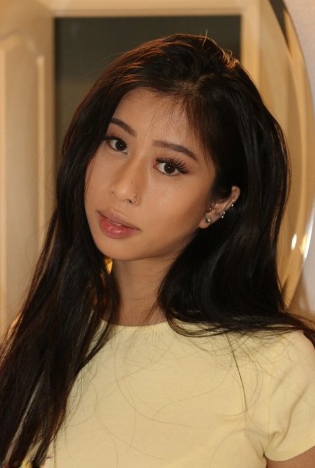 Asian beauty Jade Kush shows her damp snatch after unleashing large breasts