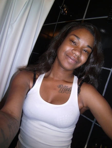 Adorable petite ebony Millian Blaze strips on her bed to get white manhood