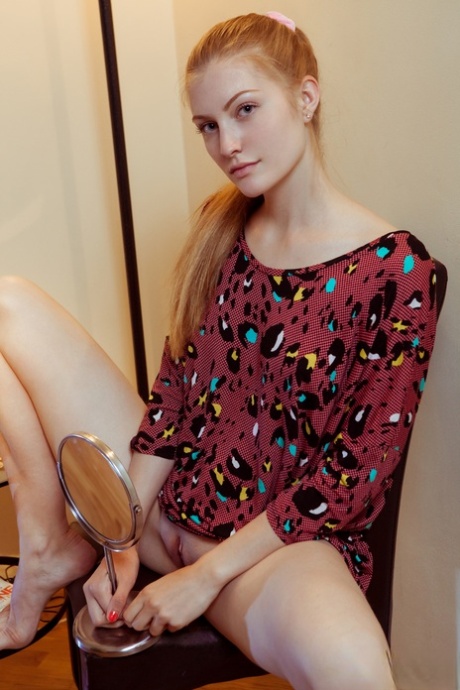 Natural redhead Bretona flashes a natural upskirt & squats artistic with legs spread