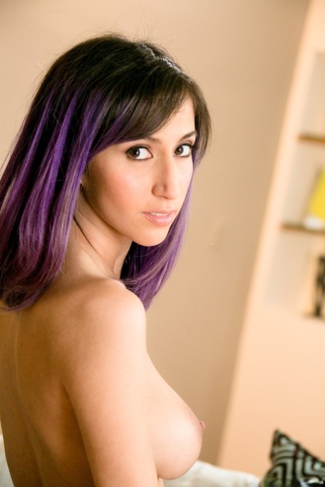 Big breasted April O'Neil takes off swimsuit and shows her hairy twat