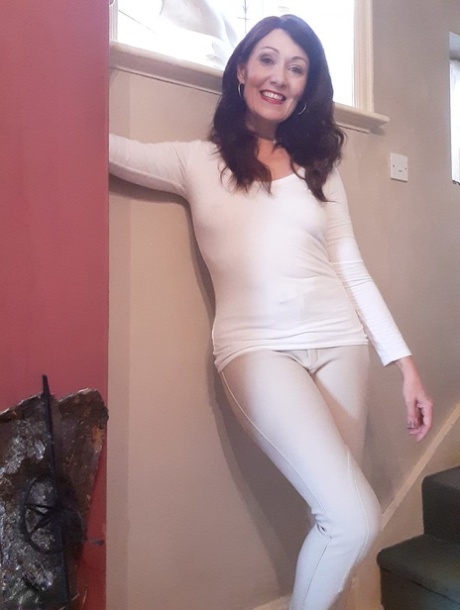 Alluring MATURE WOMAN Kitty Cream models for a non-nude shoot while at home and alone