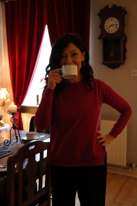 Alluring MATURE WOMAN Kitty Cream models for a non-nude shoot while at home and alone