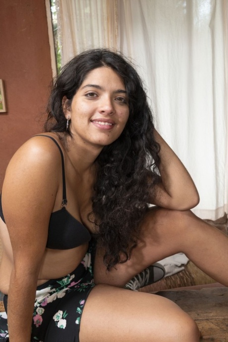 Brunette with a alluring smile Maria F opens her legs wide to show her hairy femininity