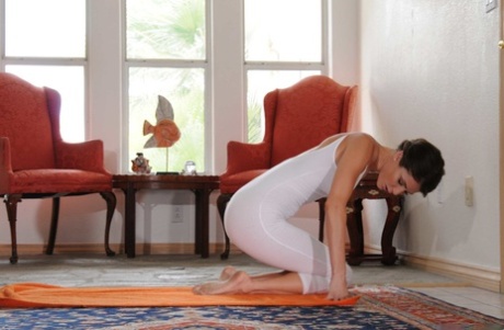 Long legged brunette Jenni Lee stripping down natural and stretching