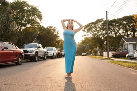 Curvaceous redhead Gina Rosini flashes her big breasts round curves and hairy twat