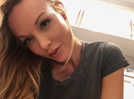 Attractive blond Kayden Kross sports long nipples while taking masturbation selfies