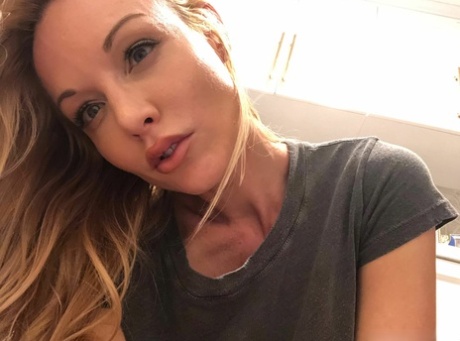Attractive blond Kayden Kross sports long nipples while taking masturbation selfies
