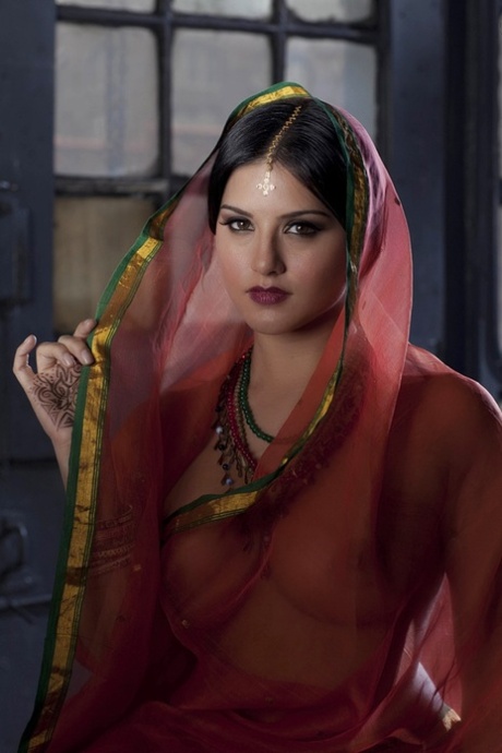 Busty solo girl Sunny Leone models solo in see thru Indian attire