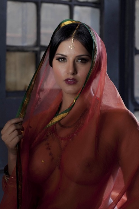 Busty solo girl Sunny Leone models solo in see thru Indian attire