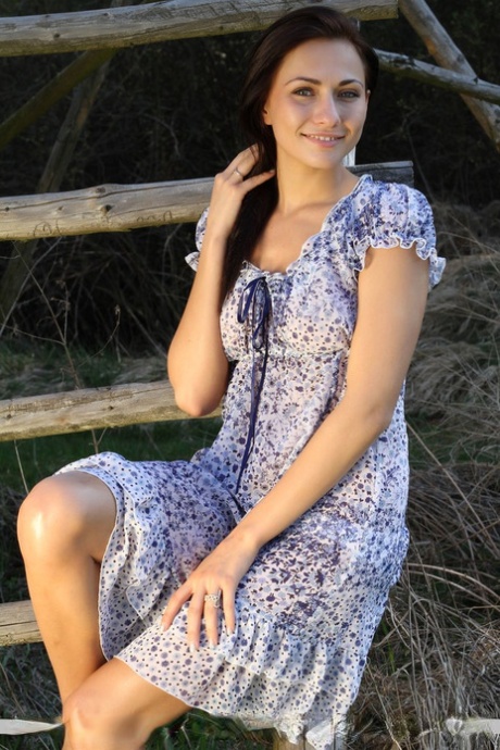 Leggy young adult solo girl Michaela Isizzu flashing white upskirt panties outside